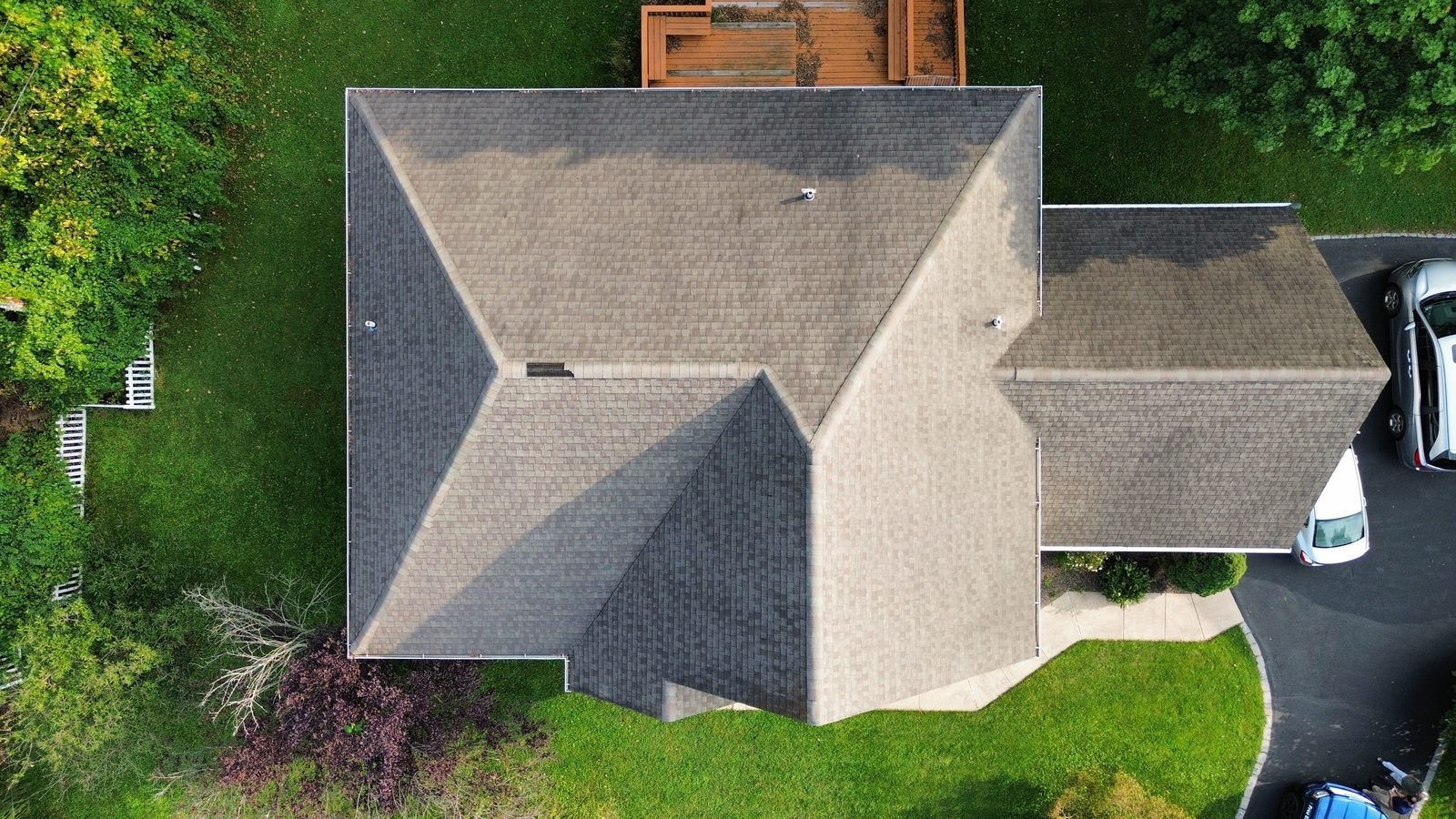 Before — top-down aerial of the original weathered brown shingle roof, Plymouth Meeting PA