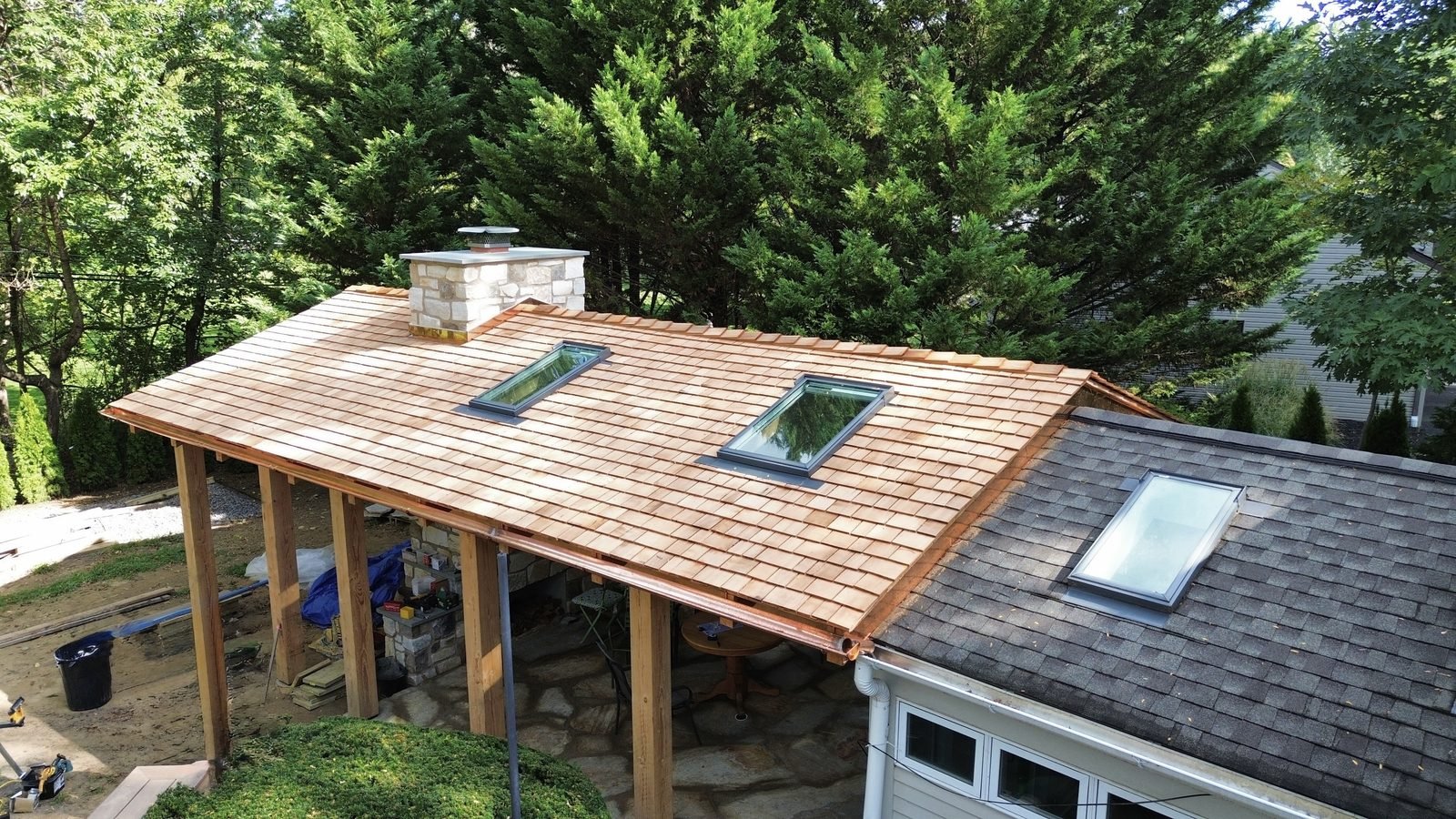 Aerial — cedar shake porch roof with two skylights and half-round copper gutters, Bryn Athyn PA — Shelby Roofing Services