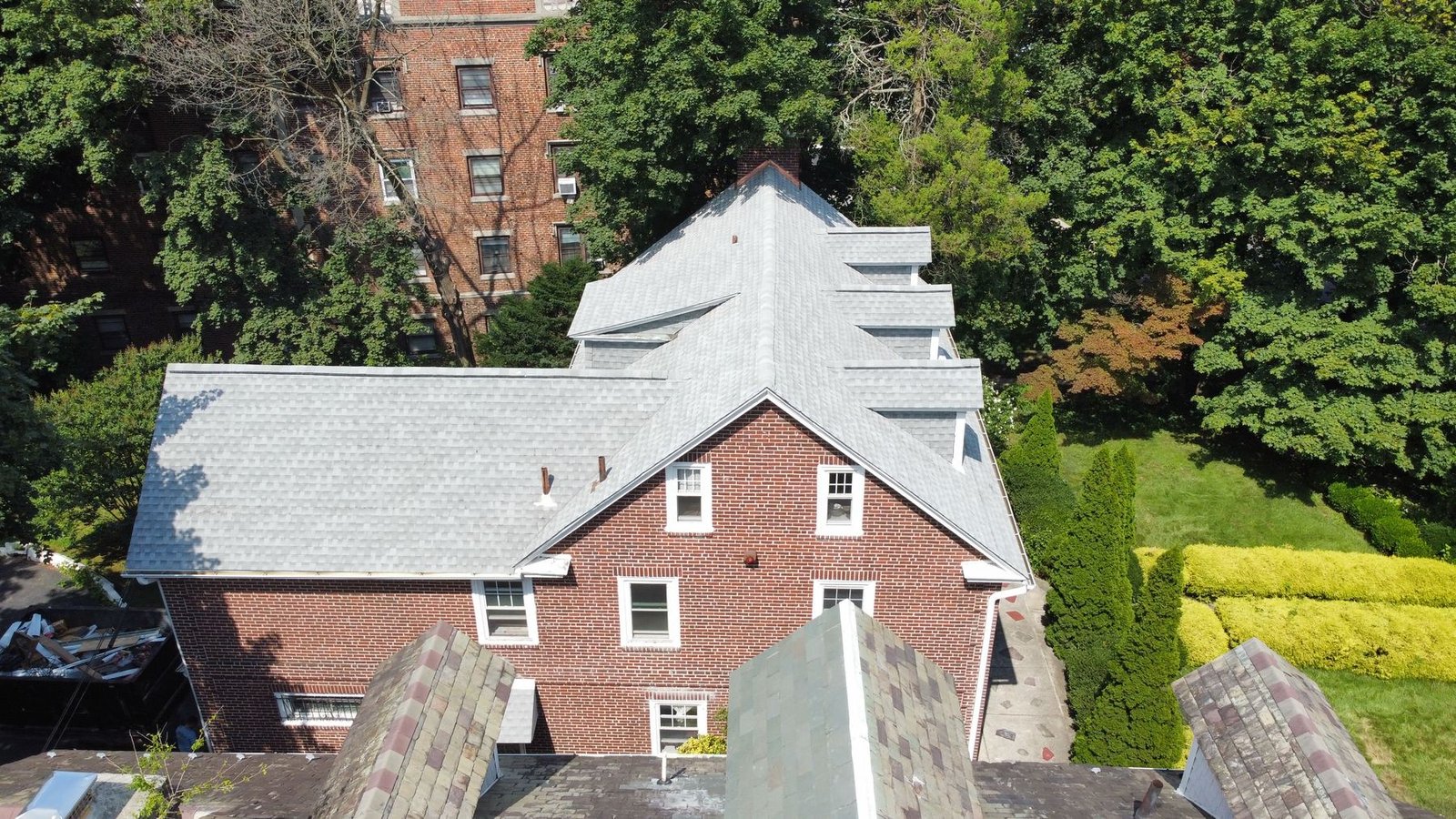 Completed shingle roof — rear aerial view, brick colonial PA