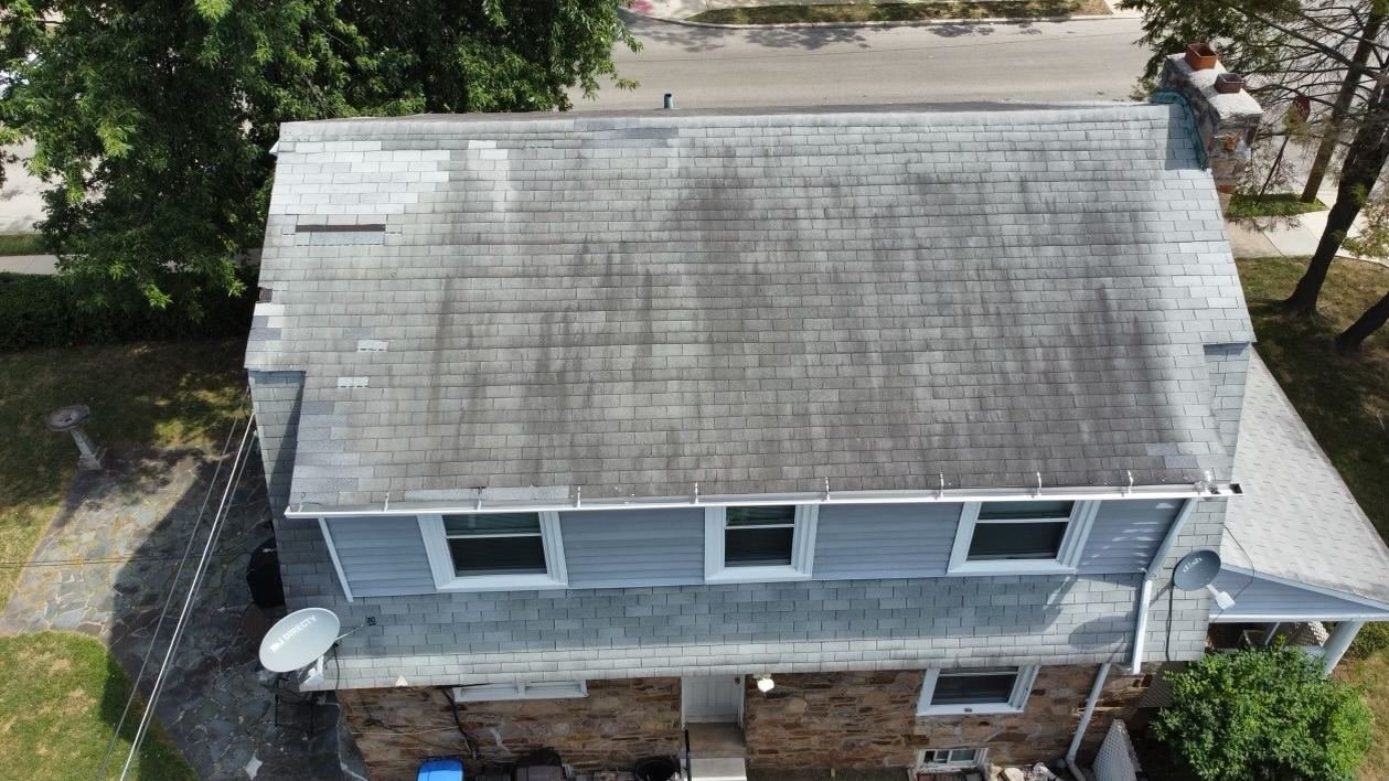Before — overhead aerial of stone colonial with worn gray shingles, PA