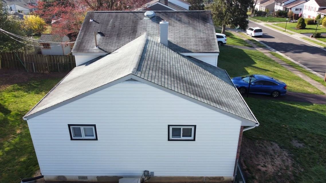 Before — rear side aerial view of home with worn shingles, PA