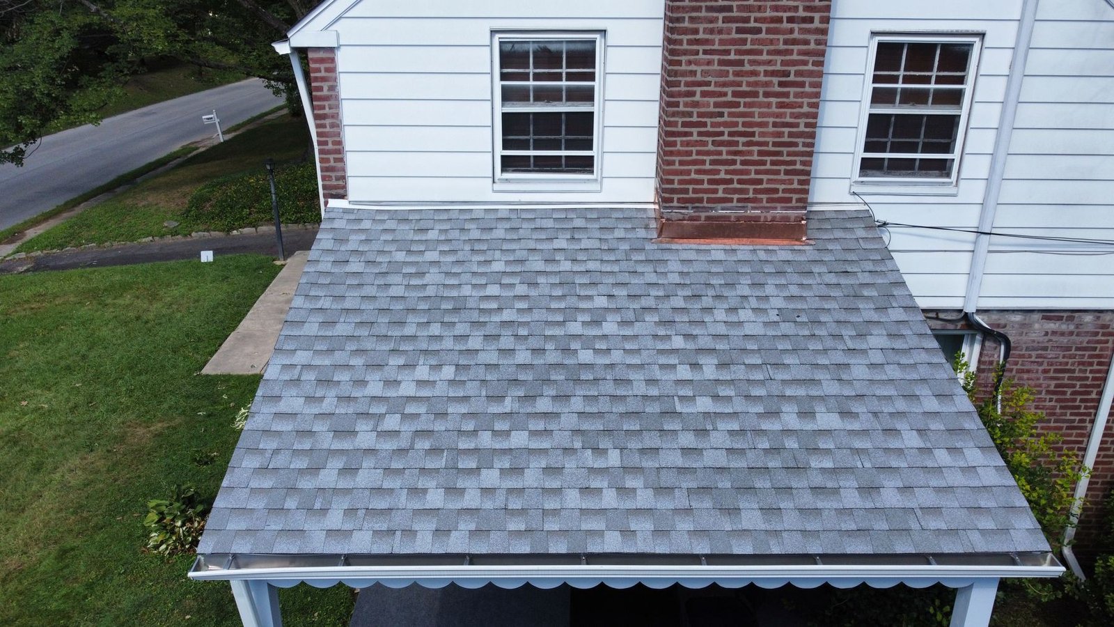 After — carport roof section with new dimensional gray shingles installed — Shelby Roofing Services PA