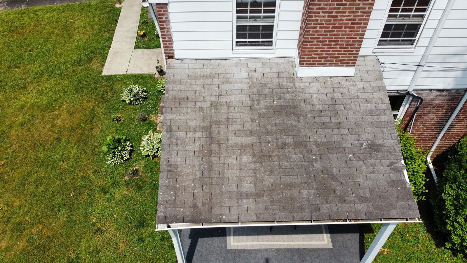 Before — close-up of badly weathered carport addition roof shingles, PA