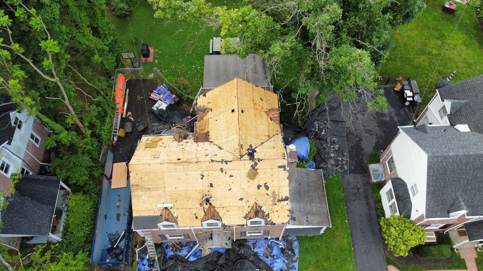 In-progress — full multi-section tear-off with new OSB decking being installed, PA