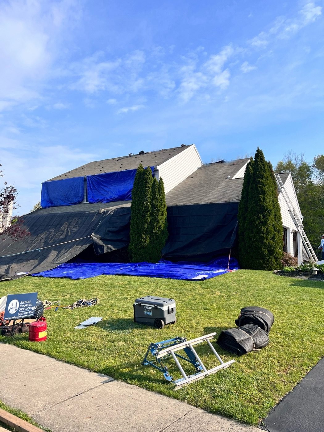 Emergency storm response — Shelby crew black tarp installation on damaged home