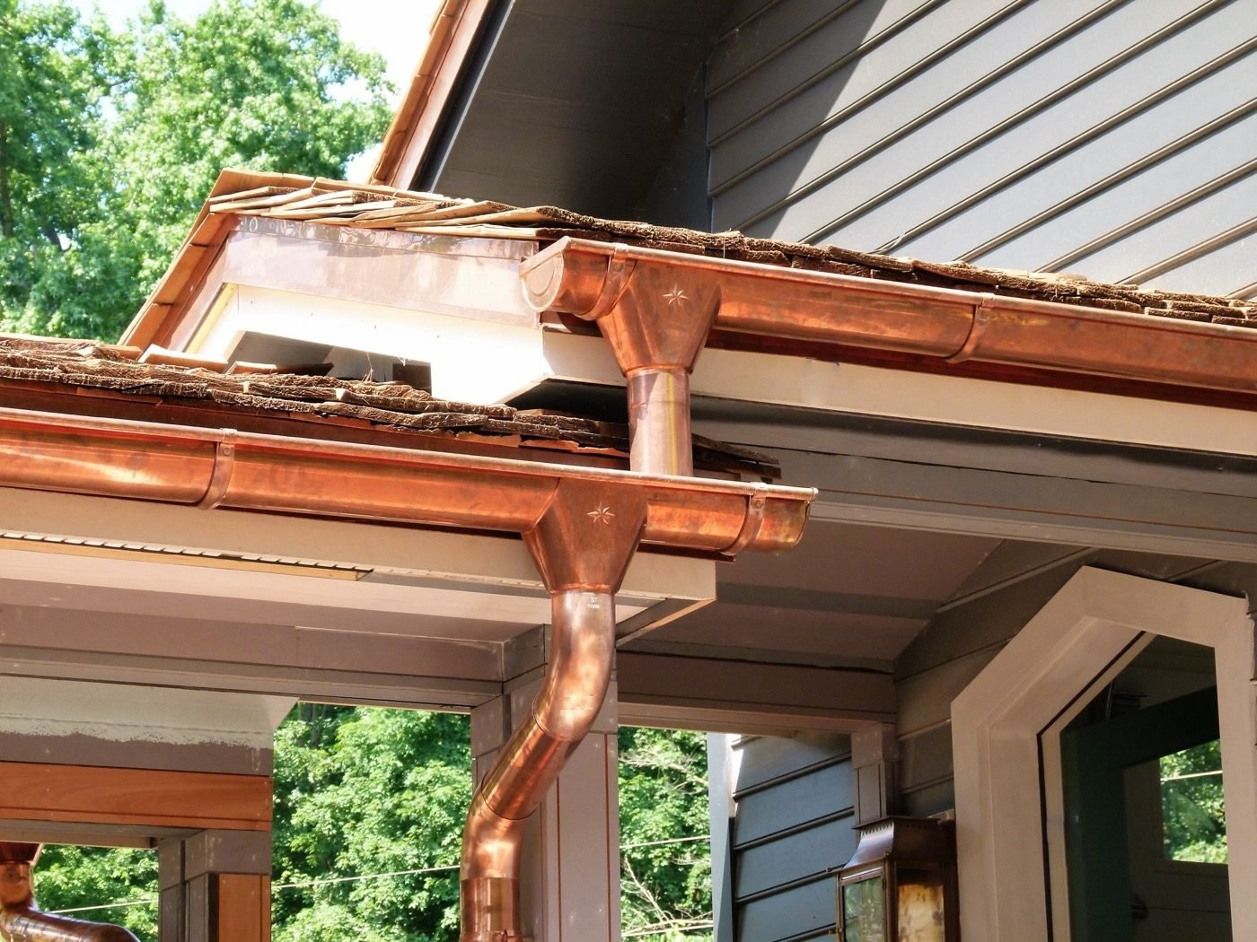 Copper gutter corner and downspout detail — Shelby Roofing Services